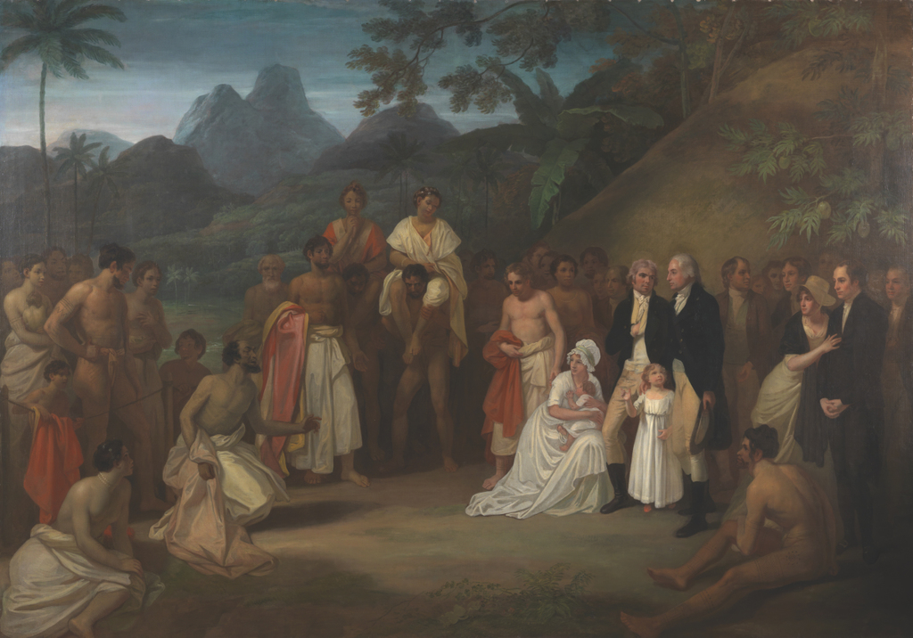 A group of individuals from diverse backgrounds gathers in a lush, tropical landscape, showcasing a moment of cultural exchange and interaction.