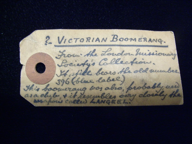 A labeled tag describing a Victorian boomerang from the London Missionary Society's Collection, noting its historical details.