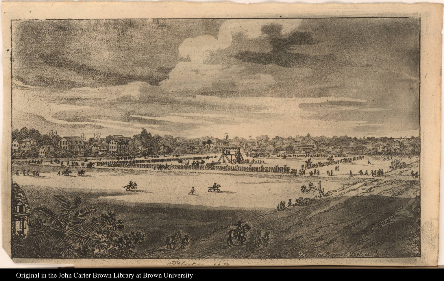 An historic image depicting a large gathering in a field with spectators, horse riders, and buildings in the background under a cloudy sky.