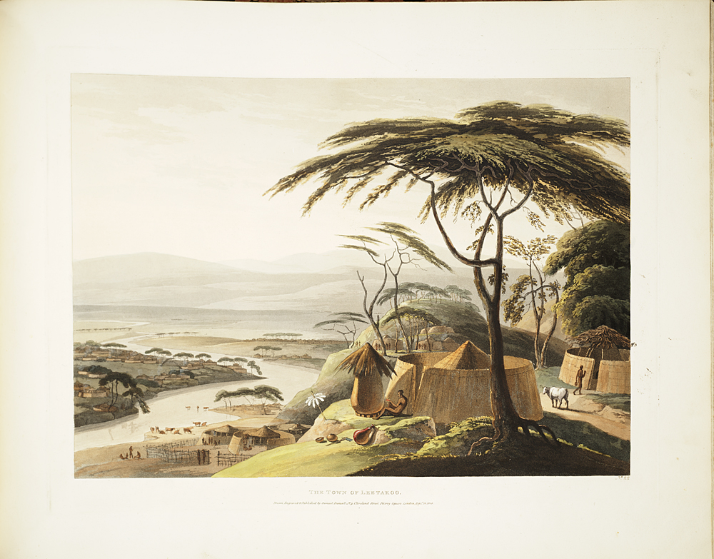 A scenic view of Laitakar, featuring traditional huts, lush trees, and a winding river, with cattle grazing in the background.