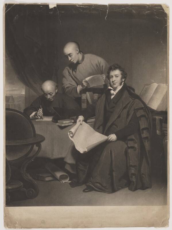 Three figures are gathered around a table filled with books and papers, with a globe and scrolls visible in a scholarly setting.